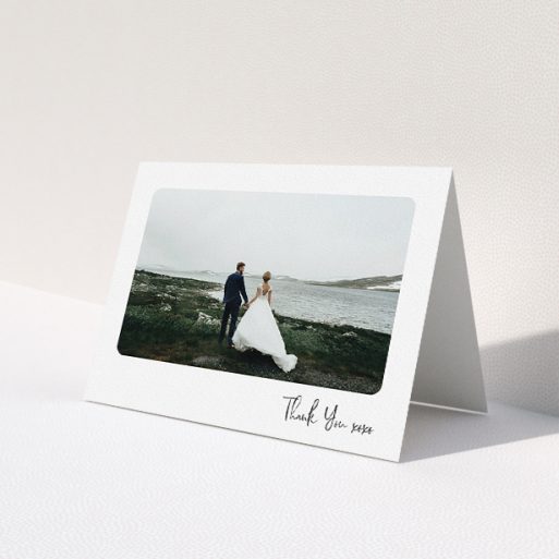 A wedding thank you card design called 'Rounded Thanks'. It is an A5 card in a landscape orientation. It is a photographic wedding thank you card with room for 1 photo. 'Rounded Thanks' is available as a folded card, with mainly white colouring.