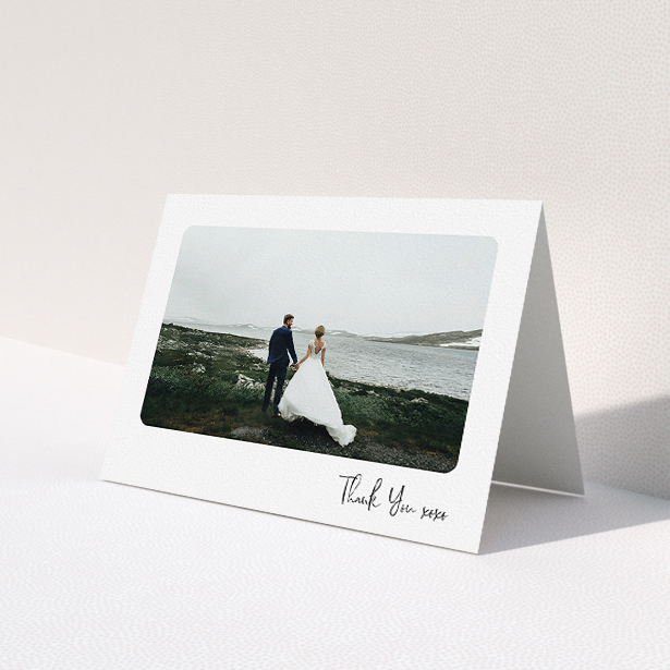 A wedding thank you card design called "Rounded Thanks". It is an A5 card in a landscape orientation. It is a photographic wedding thank you card with room for 1 photo. "Rounded Thanks" is available as a folded card, with mainly white colouring.