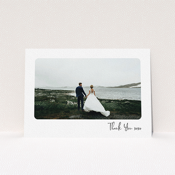 A wedding thank you card called "Rounded Thanks". It is an A6 card in a landscape orientation. It is a photographic wedding thank you card with room for 1 photo. "Rounded Thanks" is available as a flat card, with mainly white colouring.