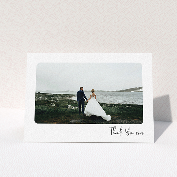 A wedding thank you card design titled "Rounded Thanks". It is an A6 card in a landscape orientation. It is a photographic wedding thank you card with room for 1 photo. "Rounded Thanks" is available as a folded card, with mainly white colouring.