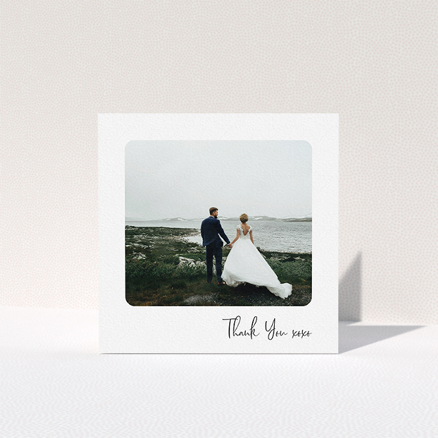 A wedding thank you card named "Rounded Thanks". It is a square (148mm x 148mm) card in a square orientation. It is a photographic wedding thank you card with room for 1 photo. "Rounded Thanks" is available as a folded card, with mainly white colouring.