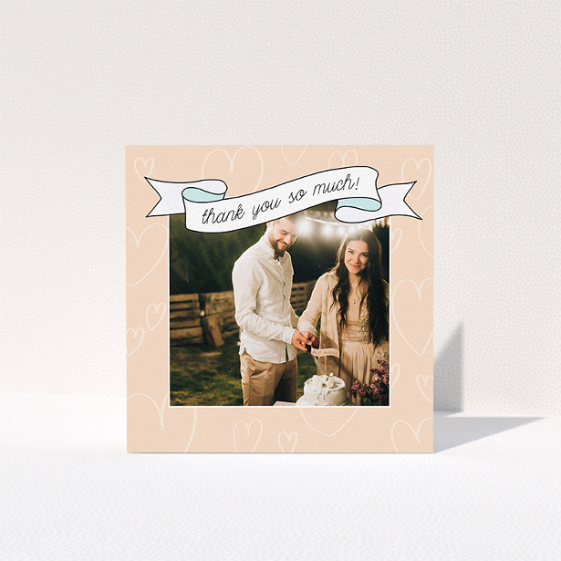 A wedding thank you card named "Rustic Thank You". It is a square (148mm x 148mm) card in a square orientation. It is a photographic wedding thank you card with room for 1 photo. "Rustic Thank You" is available as a folded card, with tones of faded yellow and light blue.