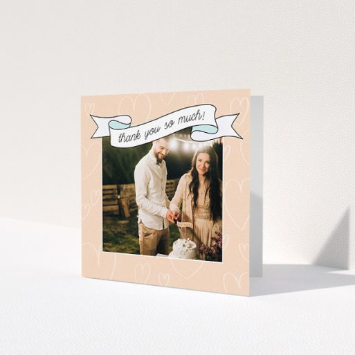 A wedding thank you card named 'Rustic Thank You'. It is a square (148mm x 148mm) card in a square orientation. It is a photographic wedding thank you card with room for 1 photo. 'Rustic Thank You' is available as a folded card, with tones of faded yellow and light blue.