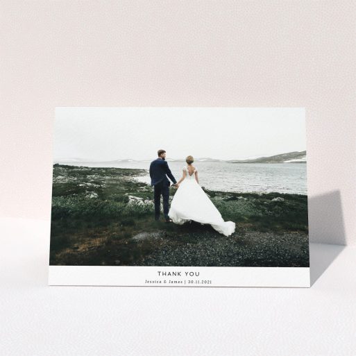Wedding Thank You Card Design - "Sans Serif" A wedding thank you card named "Sans Serif". It is an A5 card in a landscape orientation. It is a photographic wedding thank you card with room for 1 photo. "Sans Serif" is available as a folded card, with mainly white colouring.