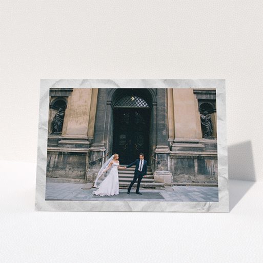 A wedding thank you card called "Sat on Marble". It is an A6 card in a landscape orientation. It is a photographic wedding thank you card with room for 1 photo. "Sat on Marble" is available as a folded card, with mainly white colouring.