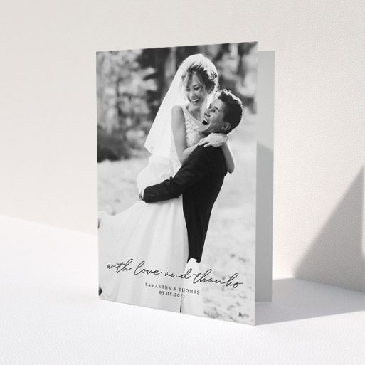 A wedding thank you card design named 'Script & Serif'. It is an A5 card in a portrait orientation. It is a photographic wedding thank you card with room for 1 photo. 'Script & Serif' is available as a folded card, with mainly black colouring.
