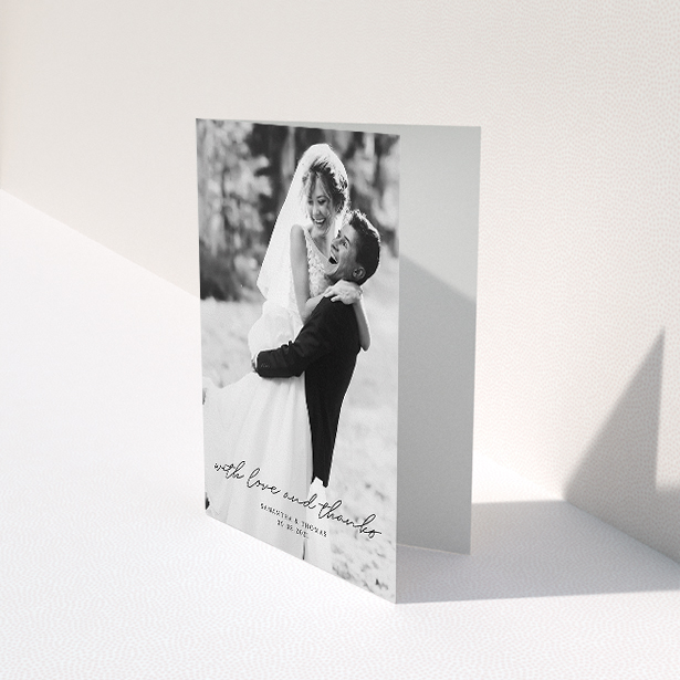 A wedding thank you card design named "Script & Serif". It is an A5 card in a portrait orientation. It is a photographic wedding thank you card with room for 1 photo. "Script & Serif" is available as a folded card, with mainly black colouring.