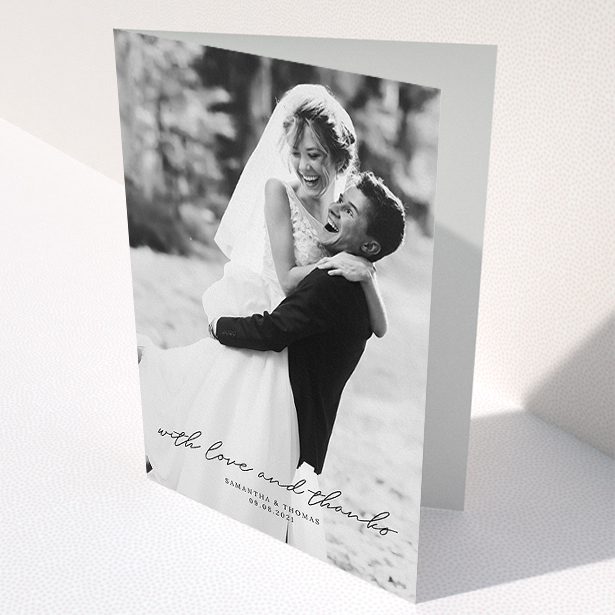 A wedding thank you card design named "Script & Serif". It is an A5 card in a portrait orientation. It is a photographic wedding thank you card with room for 1 photo. "Script & Serif" is available as a folded card, with mainly black colouring.