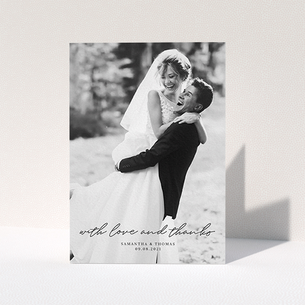 A wedding thank you card design named "Script & Serif". It is an A6 card in a portrait orientation. It is a photographic wedding thank you card with room for 1 photo. "Script & Serif" is available as a folded card, with mainly black colouring.