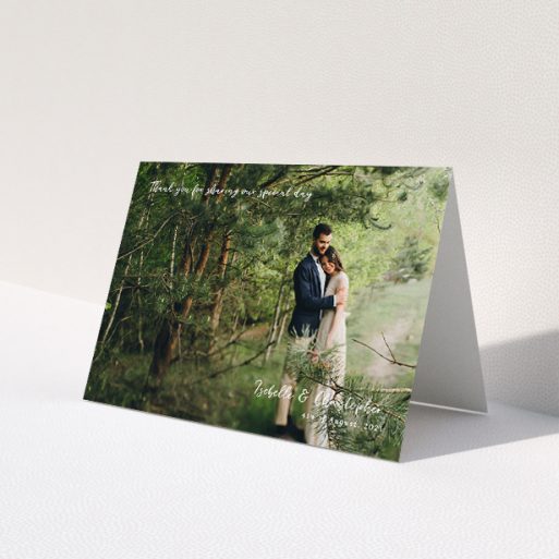 A wedding thank you card design named 'Scripted'. It is an A5 card in a landscape orientation. It is a photographic wedding thank you card with room for 1 photo. 'Scripted' is available as a folded card, with mainly white colouring.