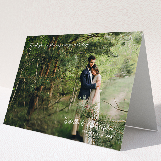 A wedding thank you card design named "Scripted". It is an A5 card in a landscape orientation. It is a photographic wedding thank you card with room for 1 photo. "Scripted" is available as a folded card, with mainly white colouring.
