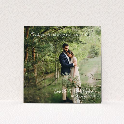A wedding thank you card template titled "Scripted". It is a square (148mm x 148mm) card in a square orientation. It is a photographic wedding thank you card with room for 1 photo. "Scripted" is available as a flat card, with mainly white colouring.