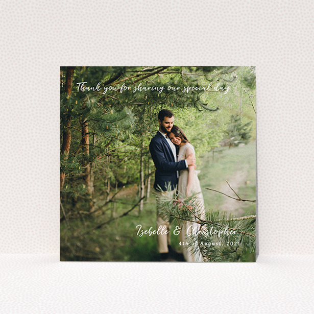 A wedding thank you card template titled "Scripted". It is a square (148mm x 148mm) card in a square orientation. It is a photographic wedding thank you card with room for 1 photo. "Scripted" is available as a flat card, with mainly white colouring.