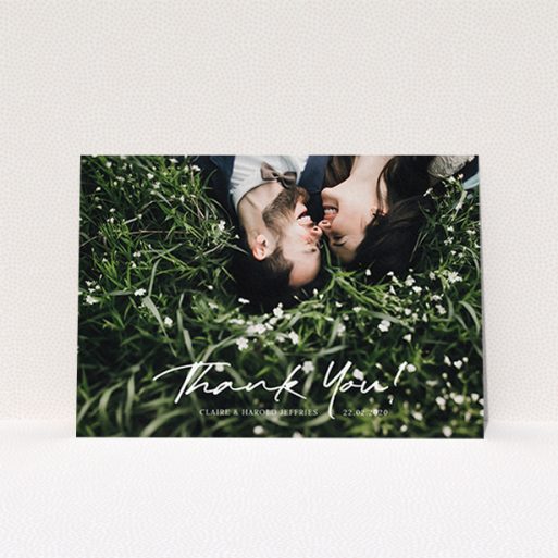 A wedding thank you card design titled "Simple Appreciation". It is an A6 card in a landscape orientation. It is a photographic wedding thank you card with room for 1 photo. "Simple Appreciation" is available as a flat card, with mainly white colouring.