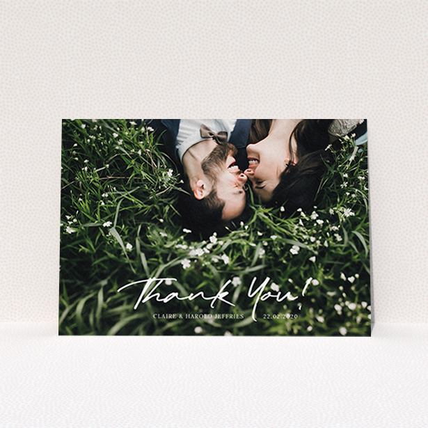 A wedding thank you card design titled "Simple Appreciation". It is an A6 card in a landscape orientation. It is a photographic wedding thank you card with room for 1 photo. "Simple Appreciation" is available as a flat card, with mainly white colouring.