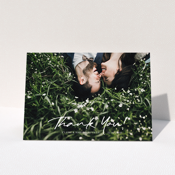 A wedding thank you card design named "Simple Appreciation". It is an A6 card in a landscape orientation. It is a photographic wedding thank you card with room for 1 photo. "Simple Appreciation" is available as a folded card, with mainly white colouring.
