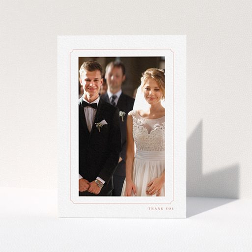 A wedding thank you card design called "Simple fine border". It is an A6 card in a portrait orientation. It is a photographic wedding thank you card with room for 1 photo. "Simple fine border" is available as a folded card, with tones of white and pink.