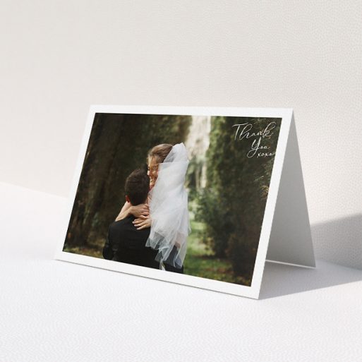 A wedding thank you card named 'Simple Landscape Thanks'. It is an A5 card in a landscape orientation. It is a photographic wedding thank you card with room for 1 photo. 'Simple Landscape Thanks' is available as a folded card, with mainly white colouring.