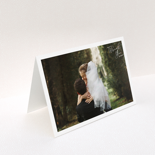 A wedding thank you card named "Simple Landscape Thanks". It is an A5 card in a landscape orientation. It is a photographic wedding thank you card with room for 1 photo. "Simple Landscape Thanks" is available as a folded card, with mainly white colouring.