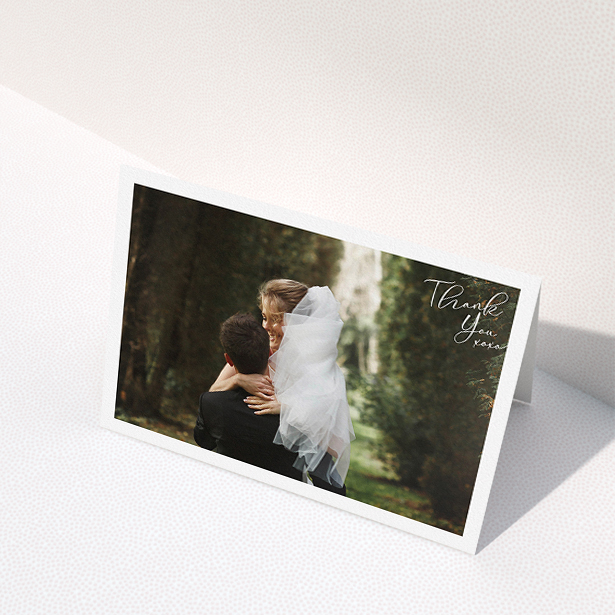 A wedding thank you card named "Simple Landscape Thanks". It is an A5 card in a landscape orientation. It is a photographic wedding thank you card with room for 1 photo. "Simple Landscape Thanks" is available as a folded card, with mainly white colouring.