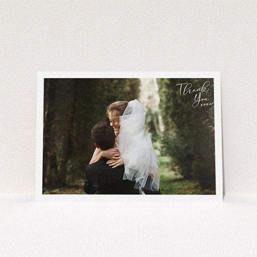 A wedding thank you card design named "Simple Landscape Thanks". It is an A6 card in a landscape orientation. It is a photographic wedding thank you card with room for 1 photo. "Simple Landscape Thanks" is available as a flat card, with mainly white colouring.