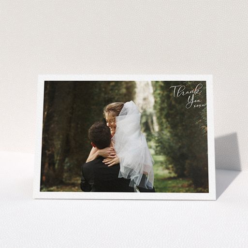 A wedding thank you card called "Simple Landscape Thanks". It is an A6 card in a landscape orientation. It is a photographic wedding thank you card with room for 1 photo. "Simple Landscape Thanks" is available as a folded card, with mainly white colouring.