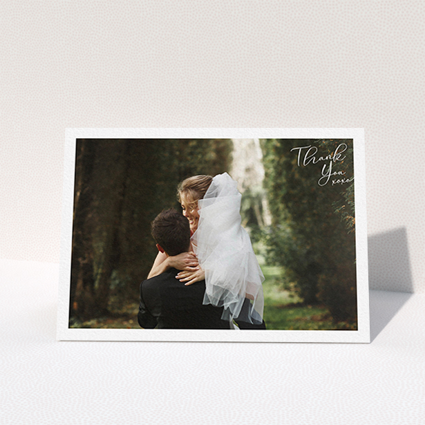 A wedding thank you card called "Simple Landscape Thanks". It is an A6 card in a landscape orientation. It is a photographic wedding thank you card with room for 1 photo. "Simple Landscape Thanks" is available as a folded card, with mainly white colouring.