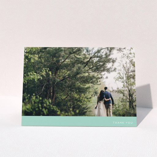 A wedding thank you card called "Simple Mint". It is an A5 card in a landscape orientation. It is a photographic wedding thank you card with room for 1 photo. "Simple Mint" is available as a folded card, with tones of green and white.