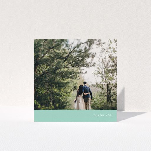A wedding thank you card design called "Simple Mint". It is a square (148mm x 148mm) card in a square orientation. It is a photographic wedding thank you card with room for 1 photo. "Simple Mint" is available as a folded card, with tones of green and white.