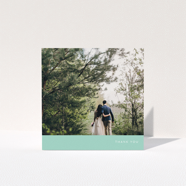 A wedding thank you card design called "Simple Mint". It is a square (148mm x 148mm) card in a square orientation. It is a photographic wedding thank you card with room for 1 photo. "Simple Mint" is available as a folded card, with tones of green and white.