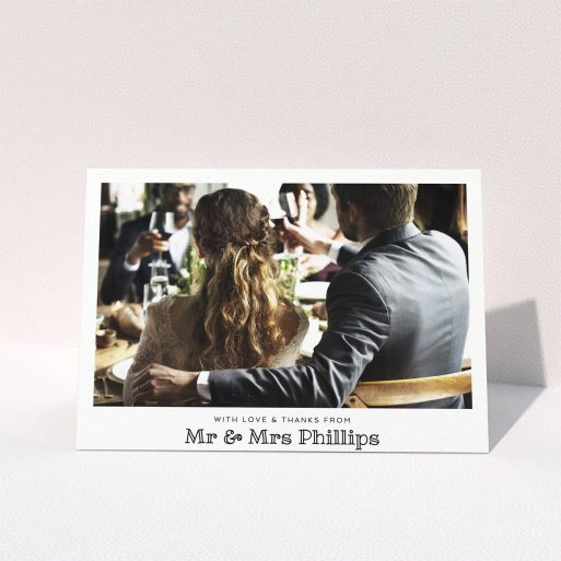 A wedding thank you card called "Simple Photo Frame". It is an A5 card in a landscape orientation. It is a photographic wedding thank you card with room for 1 photo. "Simple Photo Frame" is available as a folded card, with mainly white colouring.
