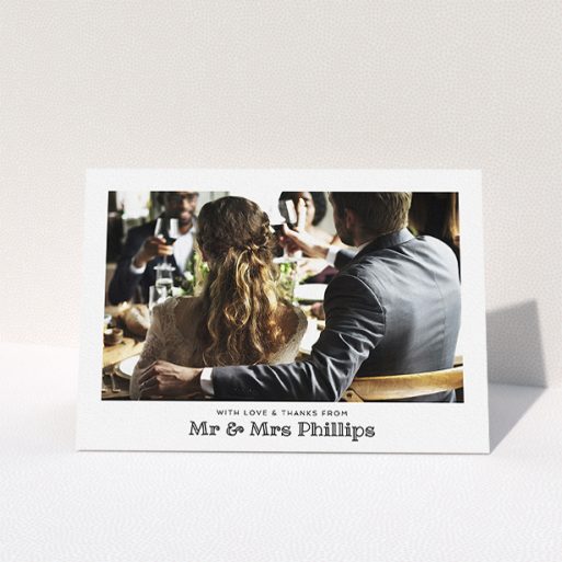 A wedding thank you card called "Simple Photo Frame". It is an A5 card in a landscape orientation. It is a photographic wedding thank you card with room for 1 photo. "Simple Photo Frame" is available as a folded card, with mainly white colouring.