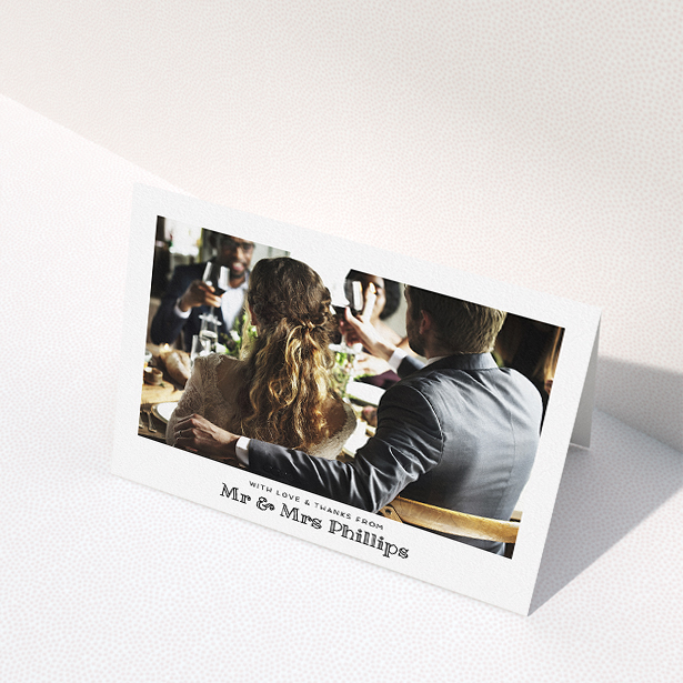 A wedding thank you card called "Simple Photo Frame". It is an A5 card in a landscape orientation. It is a photographic wedding thank you card with room for 1 photo. "Simple Photo Frame" is available as a folded card, with mainly white colouring.