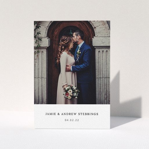 A wedding thank you card template titled "Simple, Portrait Thank You". It is an A6 card in a portrait orientation. It is a photographic wedding thank you card with room for 1 photo. "Simple, Portrait Thank You" is available as a folded card, with mainly white colouring.