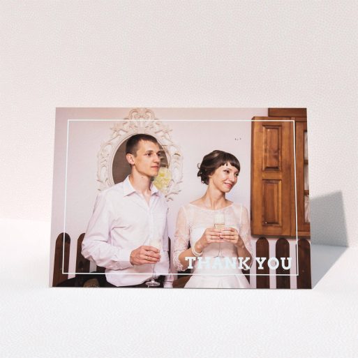 A wedding thank you card named "Simple Thank You Frame". It is an A6 card in a landscape orientation. It is a photographic wedding thank you card with room for 1 photo. "Simple Thank You Frame" is available as a folded card, with mainly white colouring.