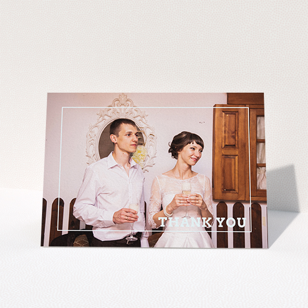 A wedding thank you card named "Simple Thank You Frame". It is an A6 card in a landscape orientation. It is a photographic wedding thank you card with room for 1 photo. "Simple Thank You Frame" is available as a folded card, with mainly white colouring.