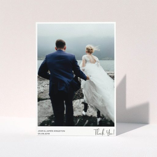 Wedding Thank You Card Design - "Simple Wedding Thank You" A wedding thank you card design titled "Simple Wedding Thank You". It is an A5 card in a portrait orientation. It is a photographic wedding thank you card with room for 1 photo. "Simple Wedding Thank You" is available as a folded card, with mainly white colouring.