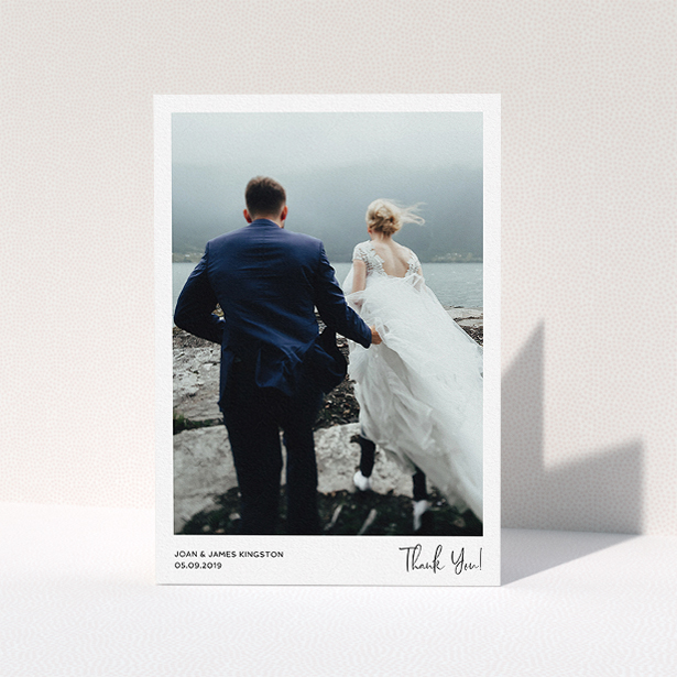 A wedding thank you card design titled "Simple Wedding Thank You". It is an A5 card in a portrait orientation. It is a photographic wedding thank you card with room for 1 photo. "Simple Wedding Thank You" is available as a folded card, with mainly white colouring.