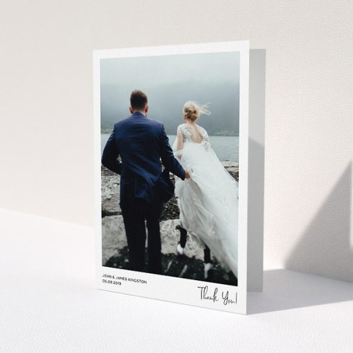 A wedding thank you card design titled 'Simple Wedding Thank You'. It is an A5 card in a portrait orientation. It is a photographic wedding thank you card with room for 1 photo. 'Simple Wedding Thank You' is available as a folded card, with mainly white colouring.