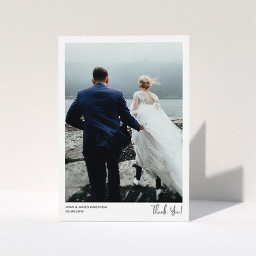 A wedding thank you card design titled "Simple Wedding Thank You". It is an A6 card in a portrait orientation. It is a photographic wedding thank you card with room for 1 photo. "Simple Wedding Thank You" is available as a folded card, with mainly white colouring.