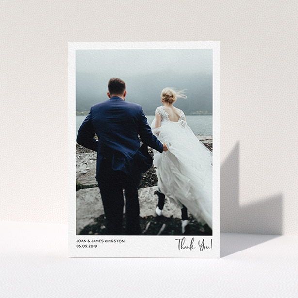 A wedding thank you card design titled "Simple Wedding Thank You". It is an A6 card in a portrait orientation. It is a photographic wedding thank you card with room for 1 photo. "Simple Wedding Thank You" is available as a folded card, with mainly white colouring.