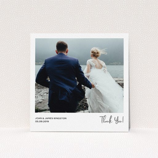A wedding thank you card design named "Simple Wedding Thank You". It is a square (148mm x 148mm) card in a square orientation. It is a photographic wedding thank you card with room for 1 photo. "Simple Wedding Thank You" is available as a flat card, with mainly white colouring.