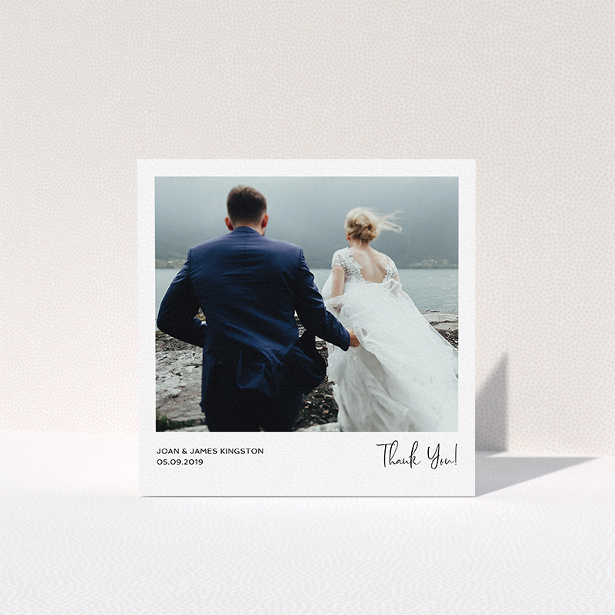 A wedding thank you card design titled "Simple Wedding Thank You". It is a square (148mm x 148mm) card in a square orientation. It is a photographic wedding thank you card with room for 1 photo. "Simple Wedding Thank You" is available as a folded card, with mainly white colouring.