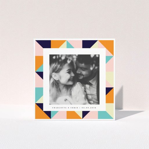 A wedding thank you card named "Sloane Squares". It is a square (148mm x 148mm) card in a square orientation. It is a photographic wedding thank you card with room for 1 photo. "Sloane Squares" is available as a folded card, with tones of pink, orange and navy blue.