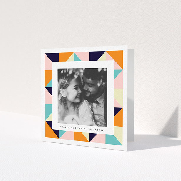 A wedding thank you card named 'Sloane Squares'. It is a square (148mm x 148mm) card in a square orientation. It is a photographic wedding thank you card with room for 1 photo. 'Sloane Squares' is available as a folded card, with tones of pink, orange and navy blue.