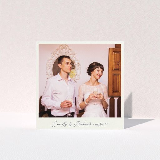 A wedding thank you card called "Snapshot". It is a square (148mm x 148mm) card in a square orientation. It is a photographic wedding thank you card with room for 1 photo. "Snapshot" is available as a folded card, with tones of white and Navy blue.