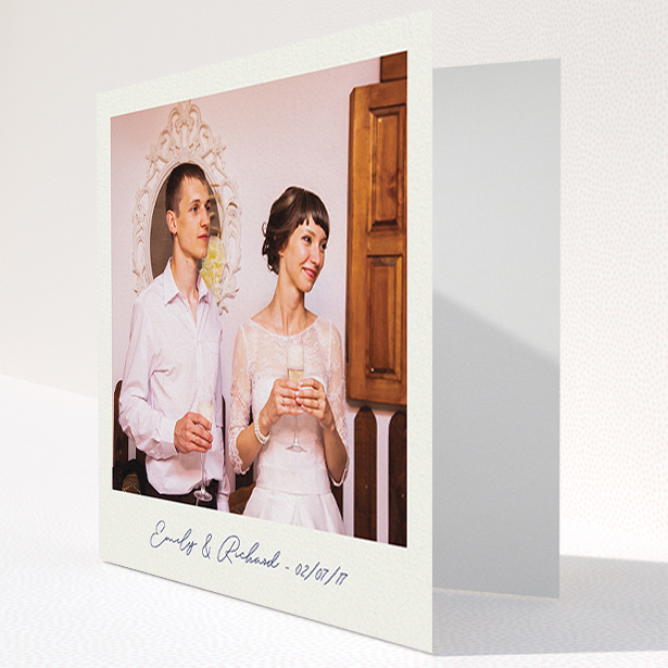 A wedding thank you card called "Snapshot". It is a square (148mm x 148mm) card in a square orientation. It is a photographic wedding thank you card with room for 1 photo. "Snapshot" is available as a folded card, with tones of white and Navy blue.