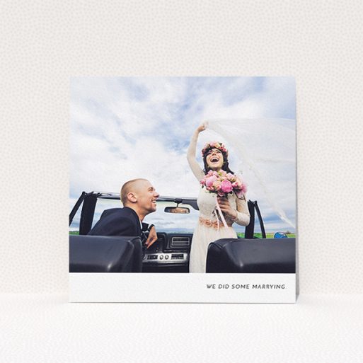 A wedding thank you card named "Split into two". It is a square (148mm x 148mm) card in a square orientation. It is a photographic wedding thank you card with room for 2 photos. "Split into two" is available as a flat card, with mainly white colouring.