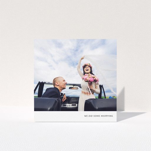 A wedding thank you card template titled "Split into two". It is a square (148mm x 148mm) card in a square orientation. It is a photographic wedding thank you card with room for 2 photos. "Split into two" is available as a folded card, with mainly white colouring.