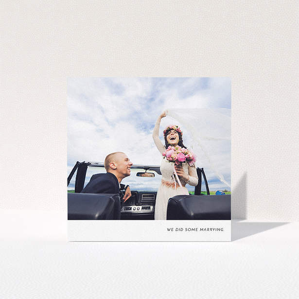 A wedding thank you card template titled "Split into two". It is a square (148mm x 148mm) card in a square orientation. It is a photographic wedding thank you card with room for 2 photos. "Split into two" is available as a folded card, with mainly white colouring.